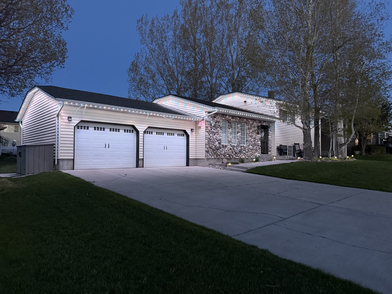 Permanent LED track on a two-story home, lit warm white